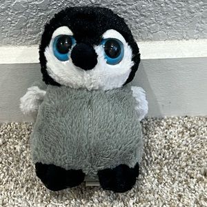 Soft little blue eyed stuffed Amal penguin